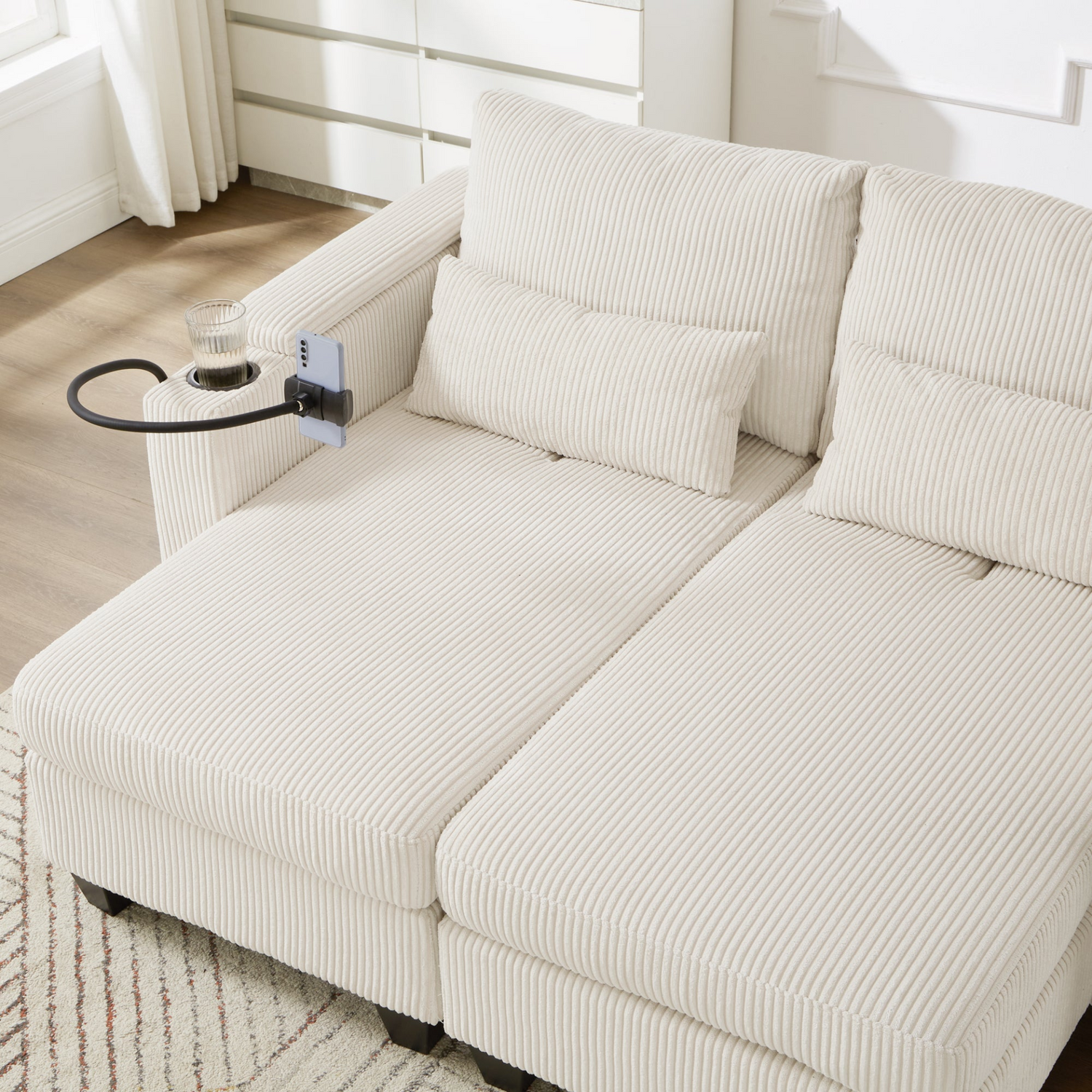 Start2Finish convertible chaise lounge sofa chair with USB ports, cup holders, phone holder, and storage in a modern living room.