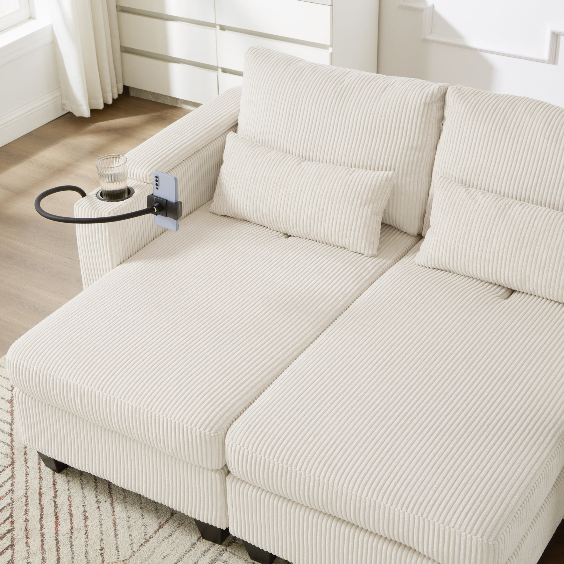 Start2Finish convertible chaise lounge sofa chair with USB ports, cup holders, phone holder, and storage in a modern living room.
