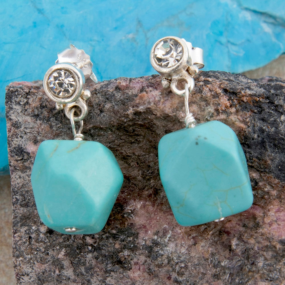 Sterling silver earrings with sparkling cubic zirconia and turquoise nugget accents, stylish jewelry by Start2Finish.