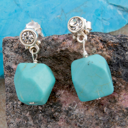 Sterling silver earrings with sparkling cubic zirconia and turquoise nugget accents, stylish jewelry by Start2Finish.