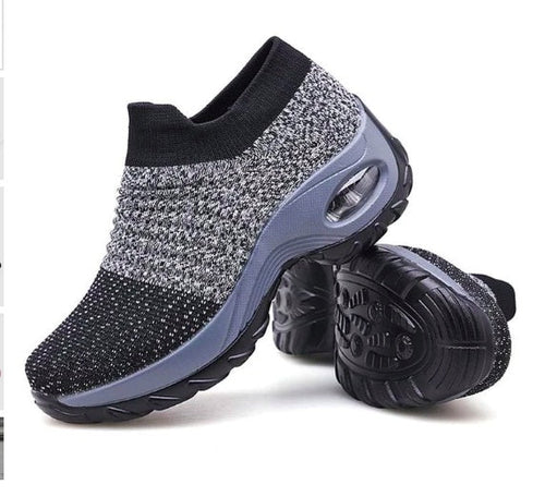 Pair of black dancing shoes from CJDropshipping, showcasing sleek design and flexible sole for performance and style.