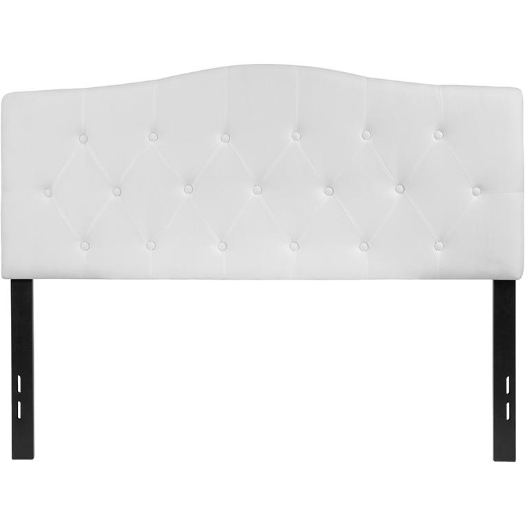 White tufted upholstered full size headboard in fabric with button-tufted design, styled for a modern bedroom.