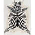 Start2Finish faux cowhide zebra rug in ivory and black with a zebra pattern, showcasing a plush, textured surface suitable for home decor.