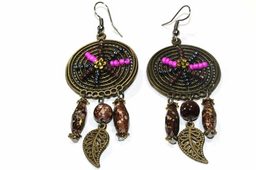 Silver Hestia Dream Catcher bead work earrings with intricate bead details and hanging feathers on silver hooks.
