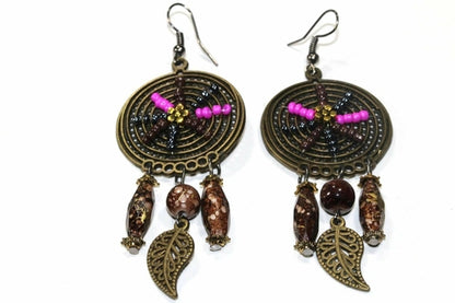 Silver Hestia Dream Catcher bead work earrings with intricate bead details and hanging feathers on silver hooks.