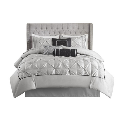 Start2Finish Laurel 7-piece tufted comforter set in grey, showcasing plush fabric and coordinated bedding pieces on a bed.