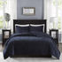 Start2Finish Harper 3-piece navy velvet quilt set with matching pillow shams and decorative pillows on a bed.