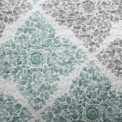 Start2Finish Claire 6-piece reversible aqua bedding daybed cover set with patterned and solid sides, displayed on a bed.