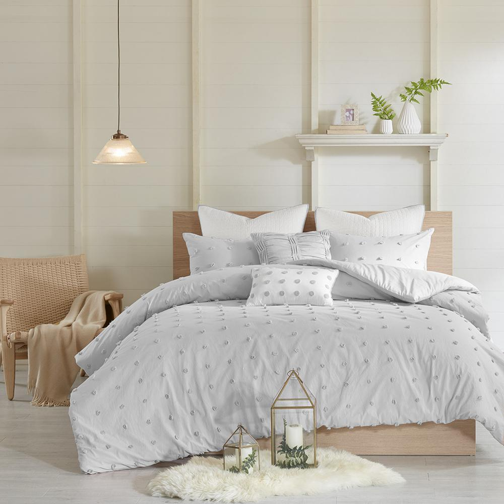 Cotton Jacquard duvet cover set with euro shams and throw pillows, featuring intricate textured patterns in neutral tones.