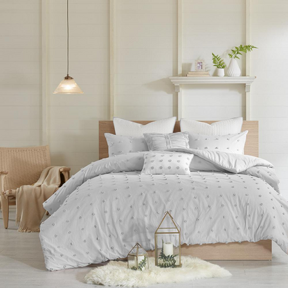 Cotton Jacquard duvet cover set with euro shams and throw pillows, featuring intricate textured patterns in neutral tones.