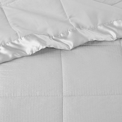Oversized Start2Finish down alternative blanket with satin trim, soft bedding for cozy comfort and elegant style.