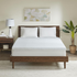 Start2Finish mattress topper shown on bed, soft quilted surface with plush padding for added comfort and support.