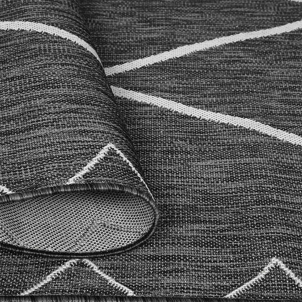 Moroccan indoor/outdoor rug by Start2Finish featuring intricate geometric patterns in vibrant colors on a textured surface.