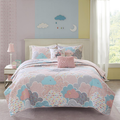Reversible cotton quilt set by Start2Finish with matching throw pillows, showcasing soft, colorful bedding on a neatly made bed.