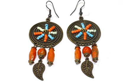 Silver Hestia Dream Catcher Bead Work Earrings with intricate bead details and hanging feather accents.