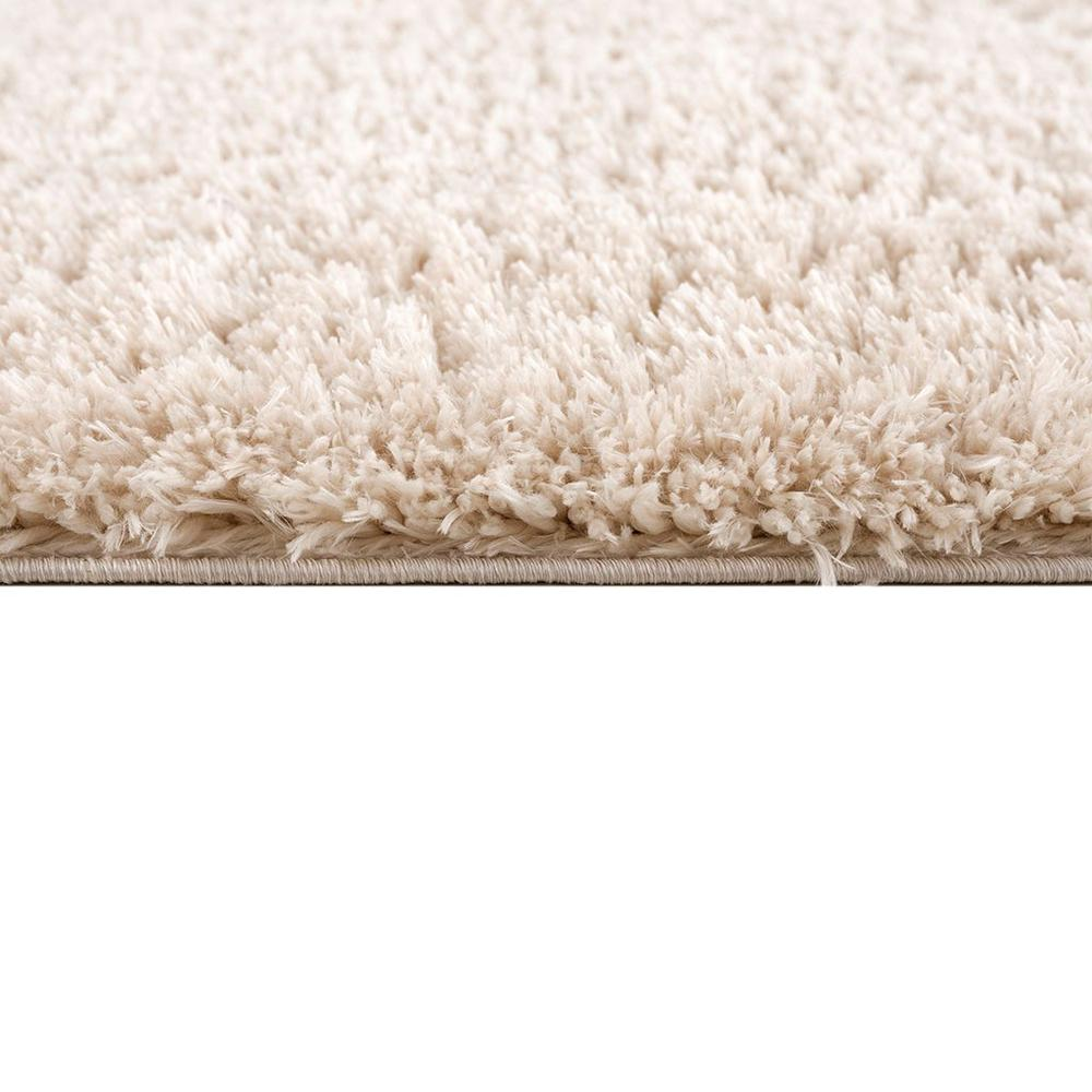 Super soft polyester shag area rug with plush texture in neutral tones, ideal for living rooms and bedrooms.