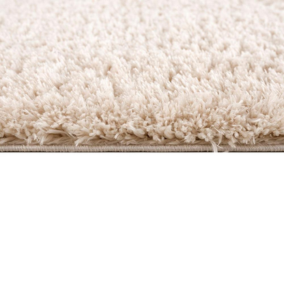 Super soft polyester shag area rug with plush texture in neutral tones, ideal for living rooms and bedrooms.