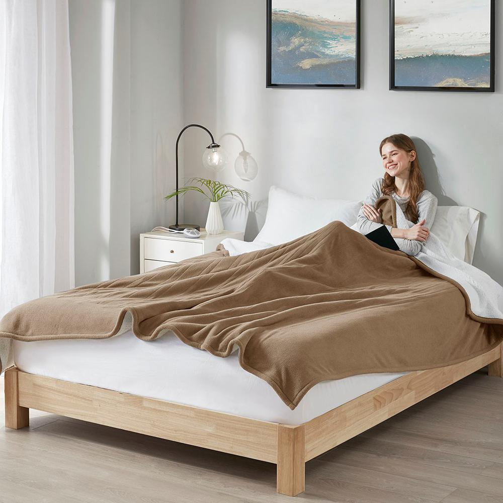 Start2Finish heated blanket spread out on a bed, showcasing its soft fabric and electric heating elements for warmth and comfort.