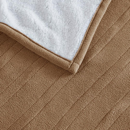 Start2Finish heated blanket with plush fabric, showing a cozy, electrically heated throw spread out on a neutral background.