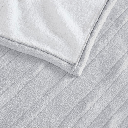 Start2Finish heated blanket in cozy bedding, showing soft fabric and control panel for adjustable warmth.