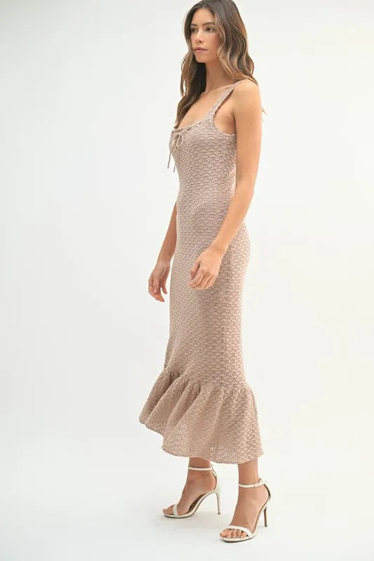 Pear Daisy ruffled hem sleeveless crochet knit midi dress, showcasing its stylish design and textured fabric.