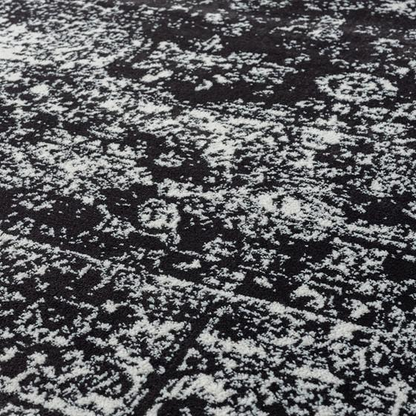 Distressed vintage Persian woven area rug with intricate patterns and warm tones, showcasing a textured, antique-inspired design.