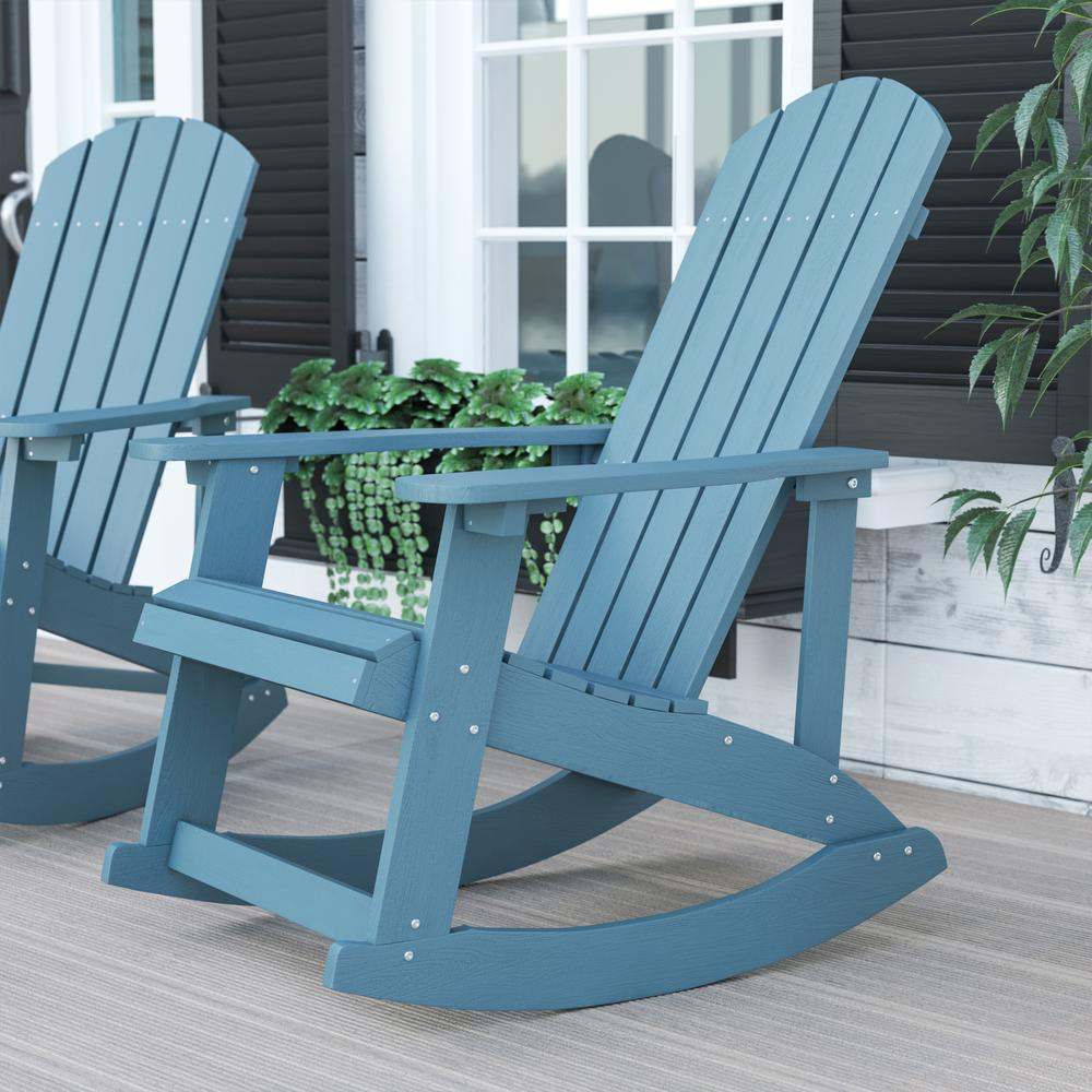 Start2Finish Adirondack rocking chair in sea foam color, outdoor furniture with wide armrests and a comfortable sloped back.