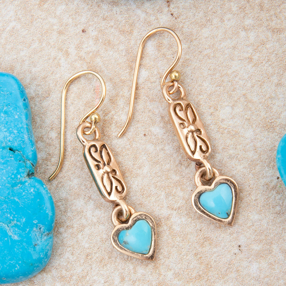 Dainty turquoise and gold drop earrings with heart-shaped charms, featuring intricate jewelry design by Start2Finish.