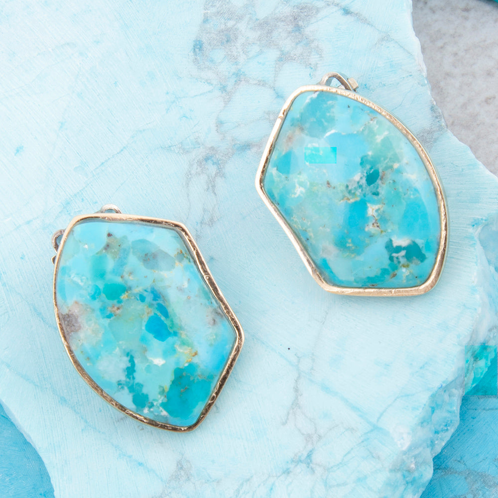 Blue turquoise and gold clip-on earrings from Start2Finish, featuring a stylish jewelry design with vibrant blue stones and gold accents.