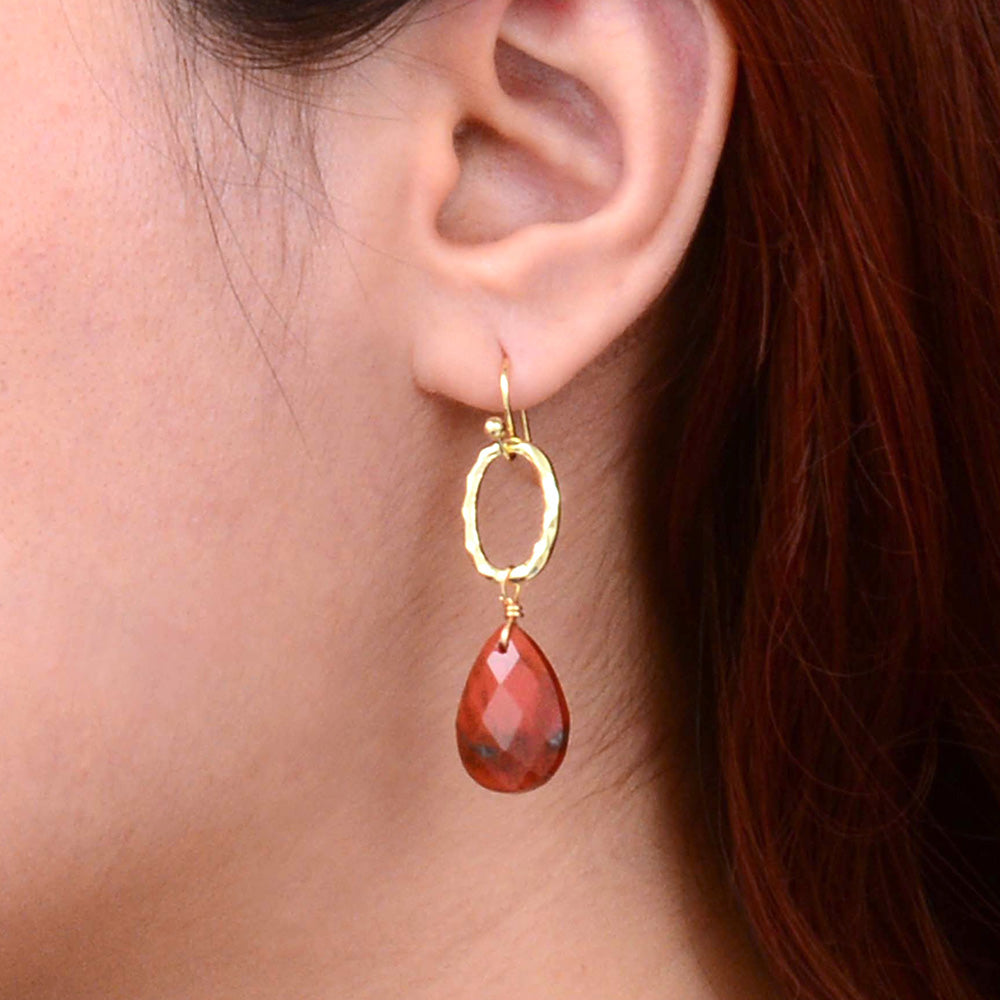 Red jasper teardrop earrings with golden drop accents, designed by Start2Finish, featuring vibrant red gemstone teardrops and elegant gold details.