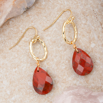 Red Jasper teardrop earrings with golden drop accents from Start2Finish, featuring polished red gemstone teardrops and elegant gold details.