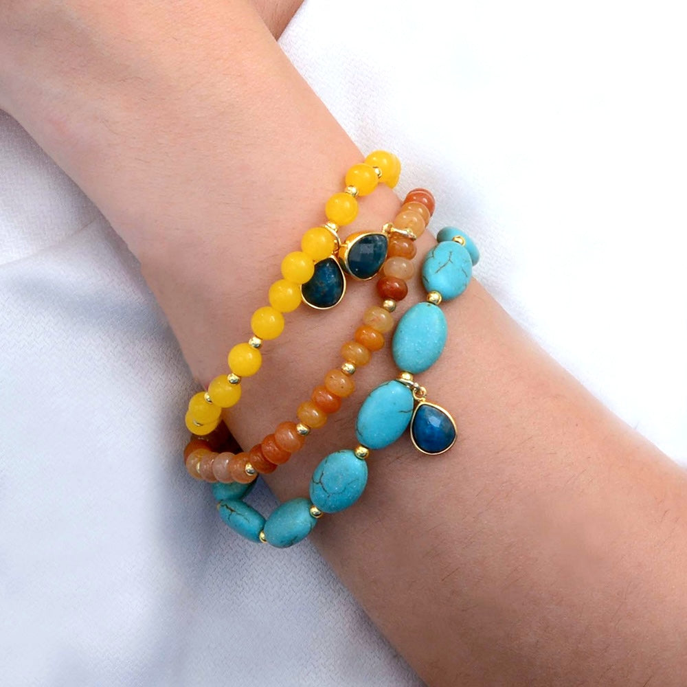 Start2Finish Patagonia jewelry set featuring blue, brown, turquoise, and golden stretch bracelets with beaded and metallic accents.