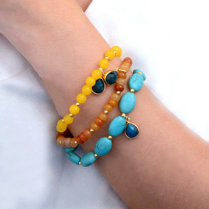 Start2Finish Patagonia jewelry set featuring blue, brown, turquoise, and golden stretch bracelets with beaded and metallic accents.