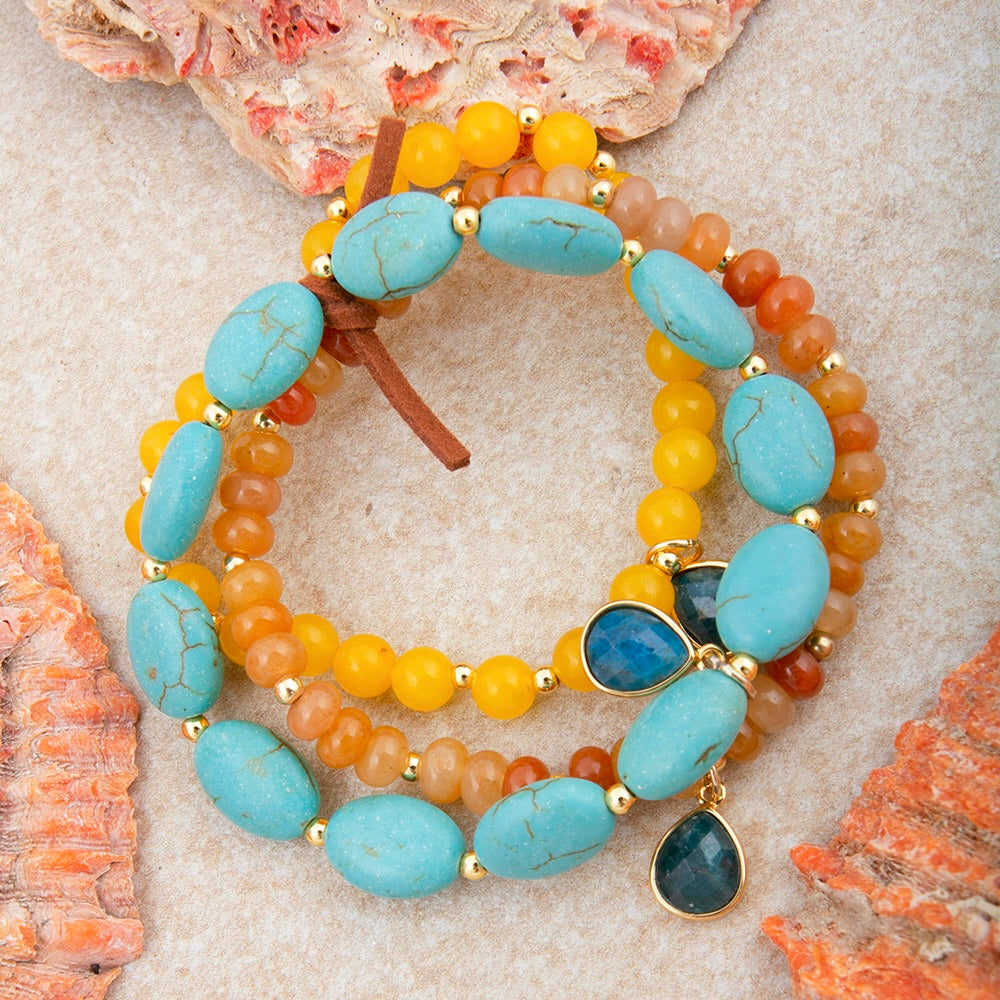 Start2Finish jewelry set featuring Patagonia blue, brown, turquoise, and gold stretch bracelet collection with colorful beads.