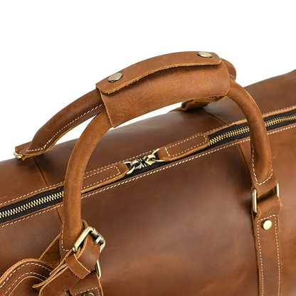 Large leather duffle bag from Start2Finish Dagny Weekender with sturdy handles and spacious interior for travel accessories.
