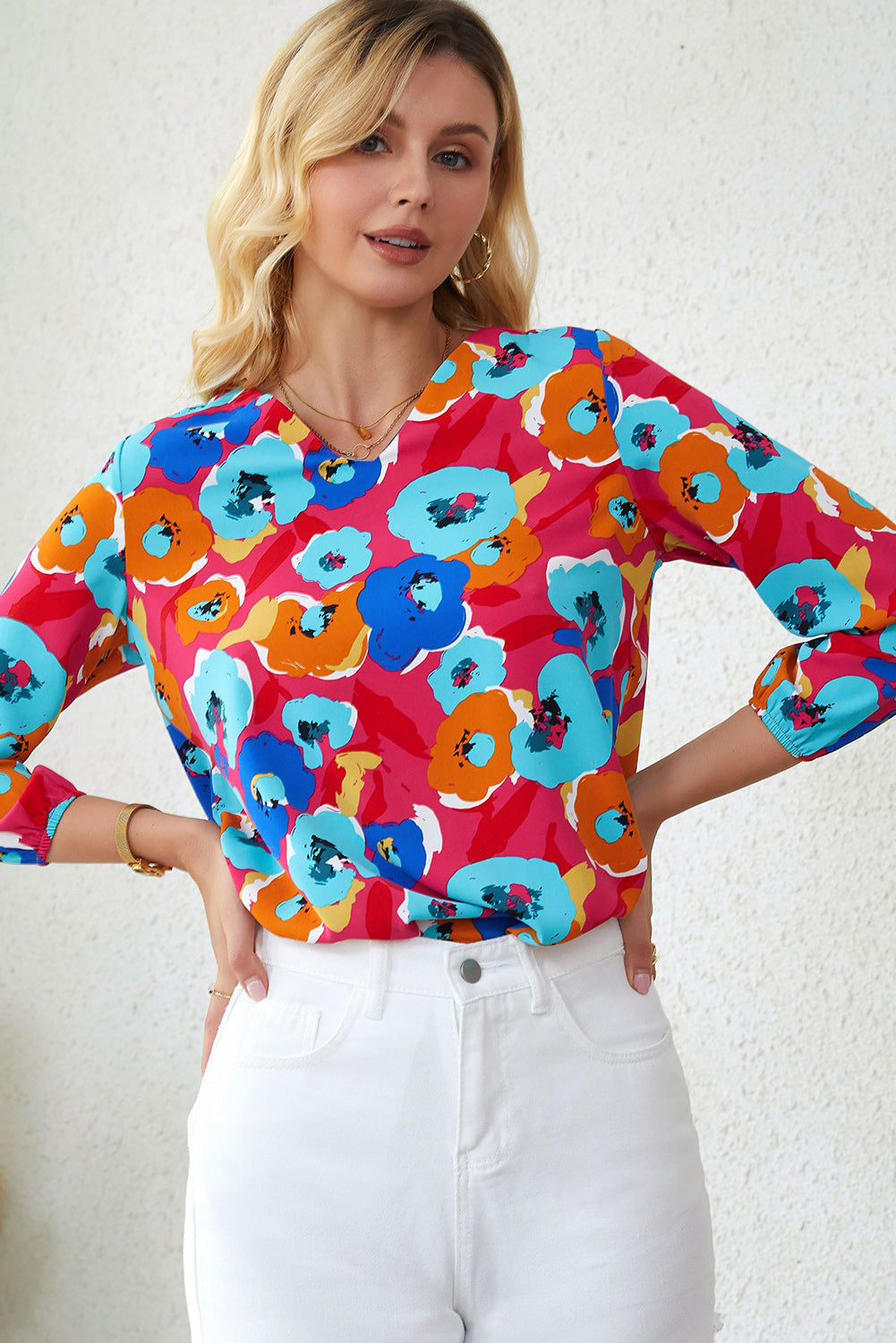 Multicolor floral print V-neck blouse with 3/4 sleeves from Carmine Juneberry, featuring a feminine, stylish design.