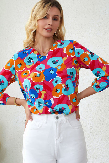 Multicolor floral print V-neck blouse with 3/4 sleeves from Carmine Juneberry, featuring a feminine, stylish design.