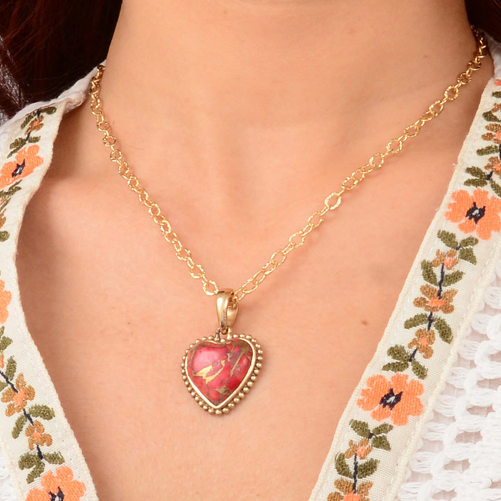 Red magnesite heart pendant necklace with gold accents, jewelry piece featuring a romantic heart design and gold chain.