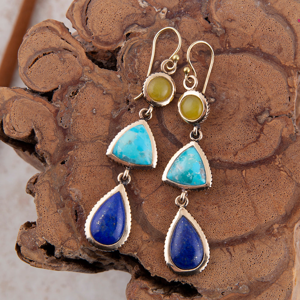 Yellow quartz and blue turquoise golden drop earrings in jewelry style, featuring elegant gold accents and vibrant gemstone details.