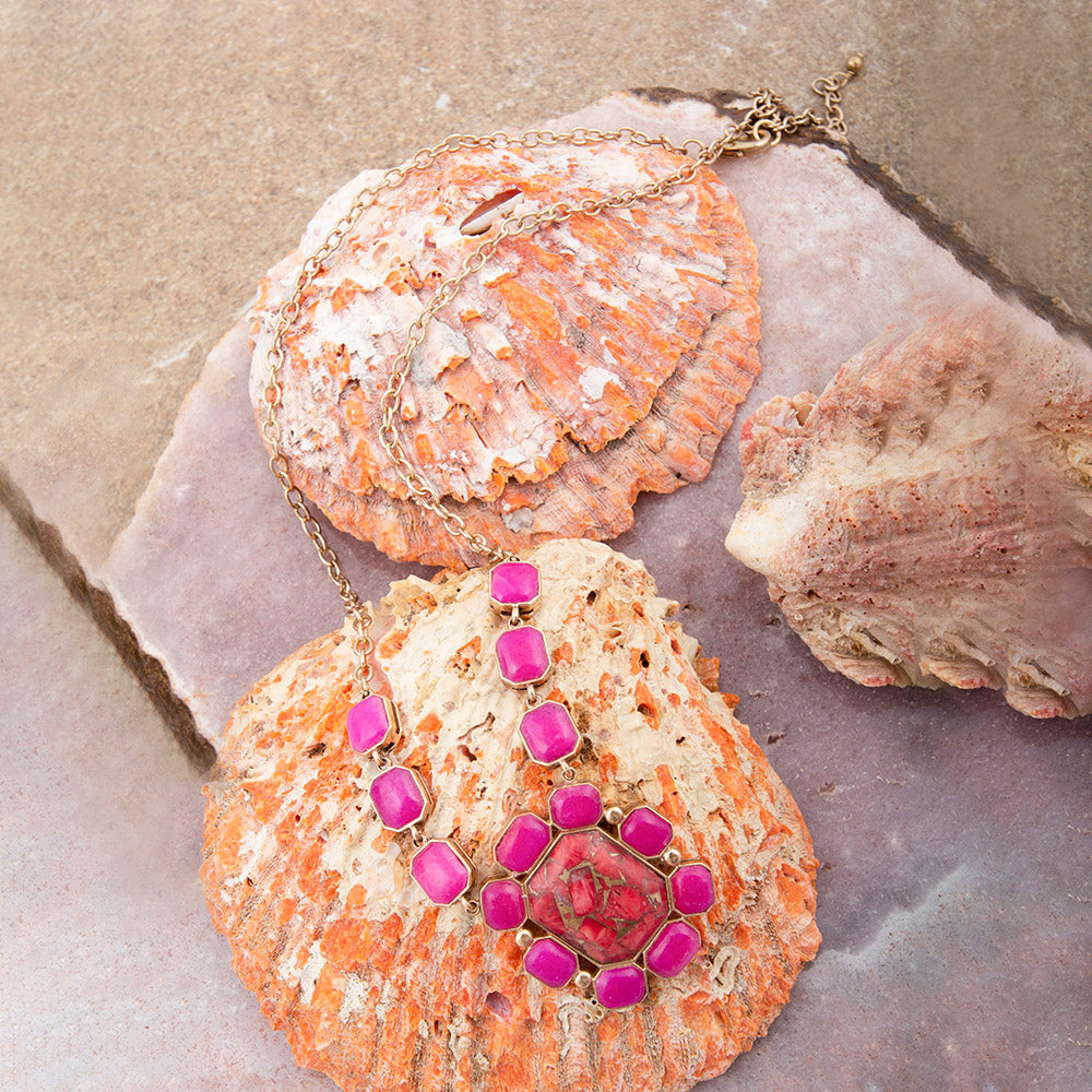 Golden statement necklace featuring red magnesite and pink quartz beads, with intricate jewelry design by Start2Finish.