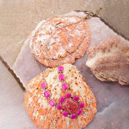 Golden statement necklace featuring red magnesite and pink quartz beads, with intricate jewelry design by Start2Finish.