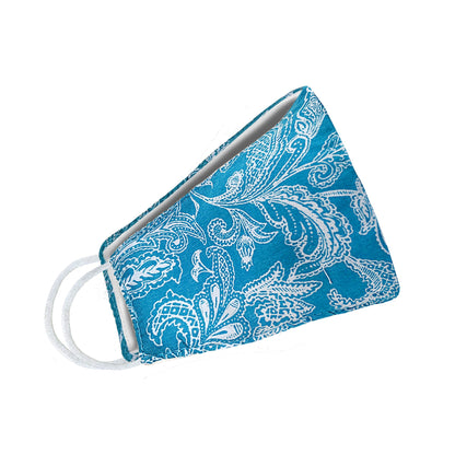Turquoise paisley floral face mask for women by Cyan Poppy, featuring white paisley pattern on fabric.