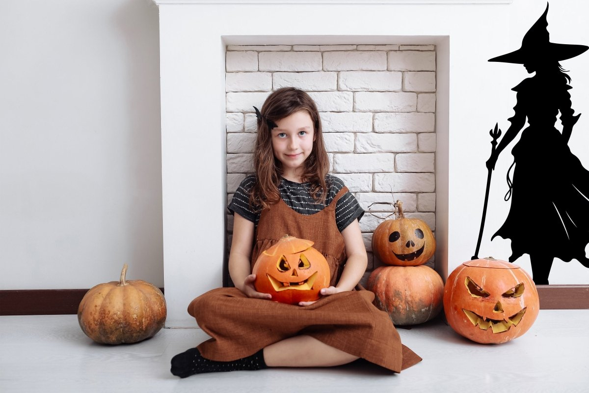 Black witch silhouette decal for Halloween home decor, featuring an elegant witch figure with a broomstick design.