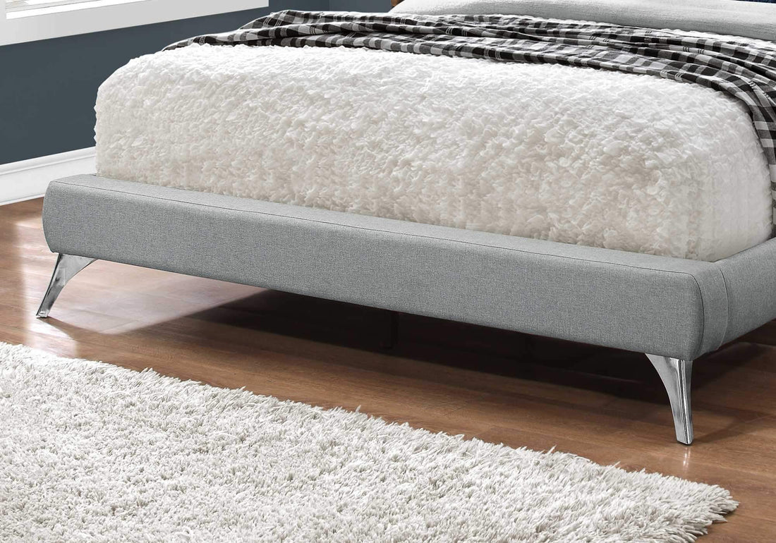 Grey foam and solid wood queen-sized bed with linen upholstery, measuring 70.5 x 87.25 x 45.25 inches by Jade.