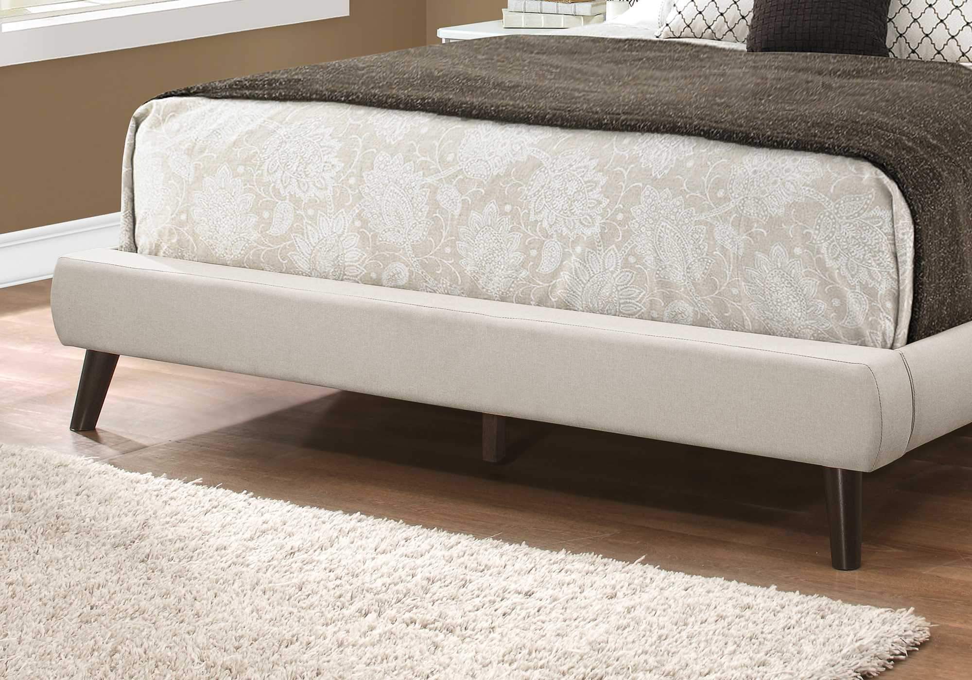Grey foam and solid wood queen-sized bed by Jade with linen upholstery, measuring 70.5" x 87.25" x 45.25" in a modern furniture style.