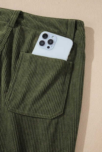 Green high waist corduroy pants with square pockets by Carmine Juneberry, featuring a stylish and comfortable fit.