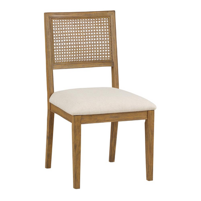 Two Alaina Cane Back Dining Chairs in linen fabric with coastal wash finish, showcasing their elegant design and woven cane detailing.