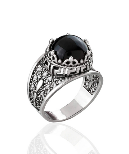Silver cocktail ring with black onyx gemstone and intricate meander filigree pattern, designed for women.