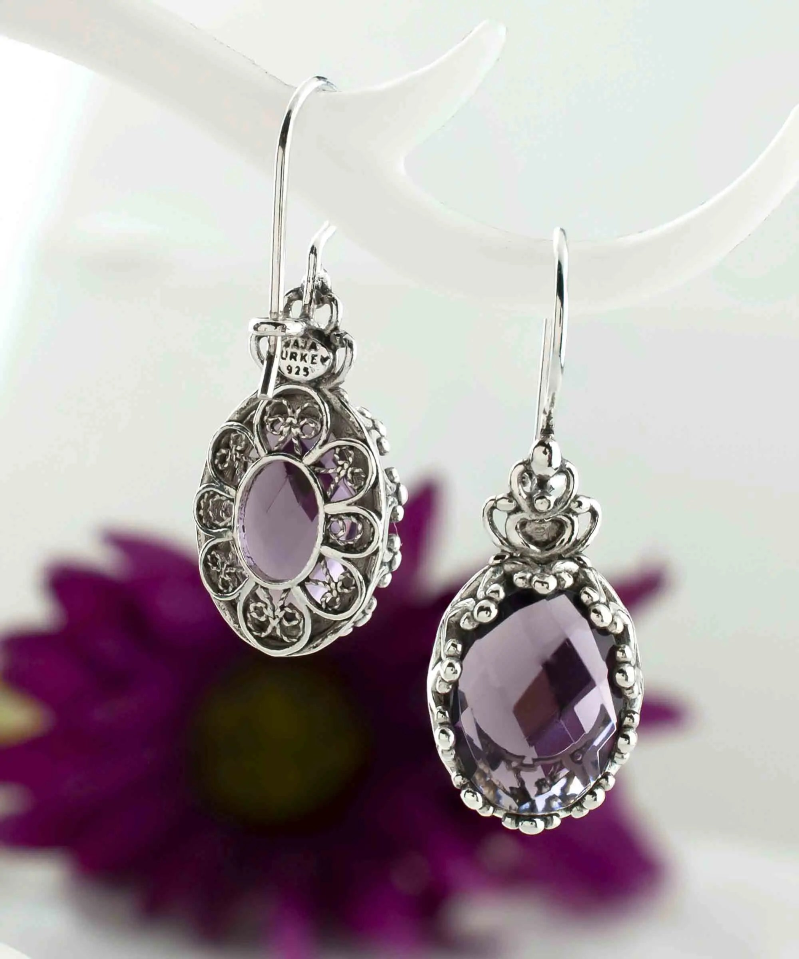 Silver oval drop earrings with filigree art and amethyst gemstones, featuring a crown design for women.