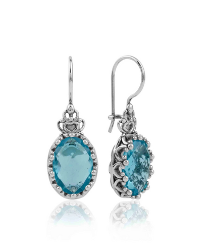 Silver oval drop earrings with intricate filigree design and blue topaz gemstones, featuring crown-shaped figures for women.